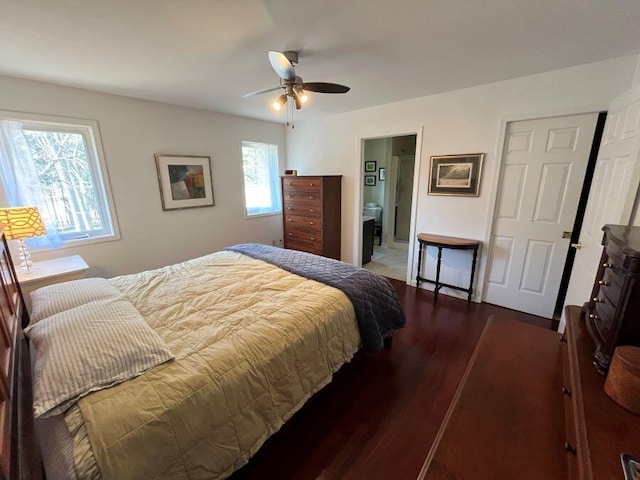 bedroom featuring a ceiling fan, ensuite bath, and wood finished floors