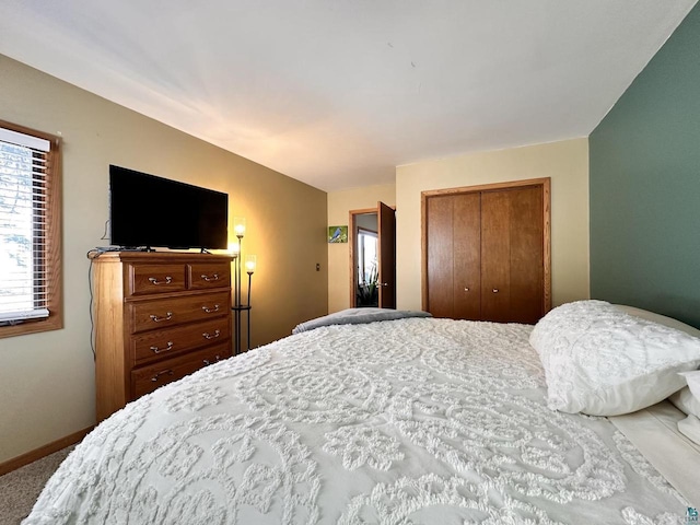 bedroom featuring a closet and baseboards