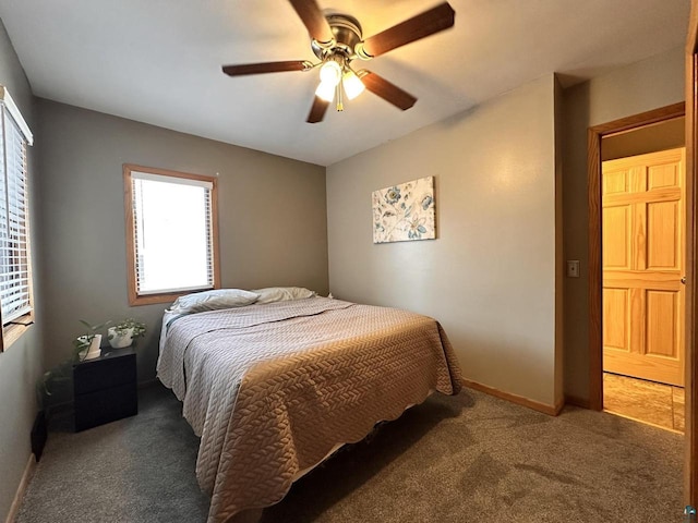 bedroom with baseboards, ceiling fan, and carpet flooring