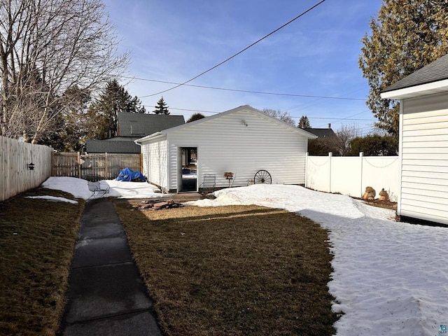 view of yard with an outdoor structure and a fenced backyard