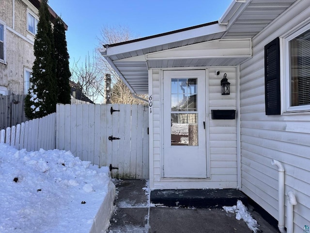 doorway to property with fence