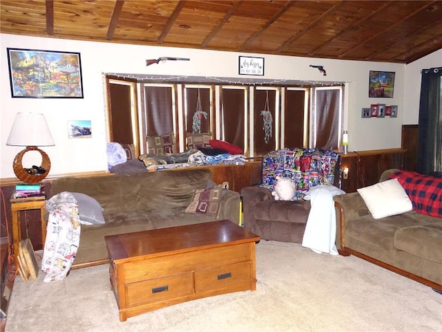 carpeted living area with wood ceiling and vaulted ceiling