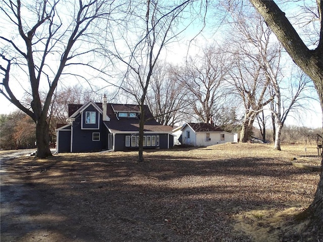 view of front of home with a chimney