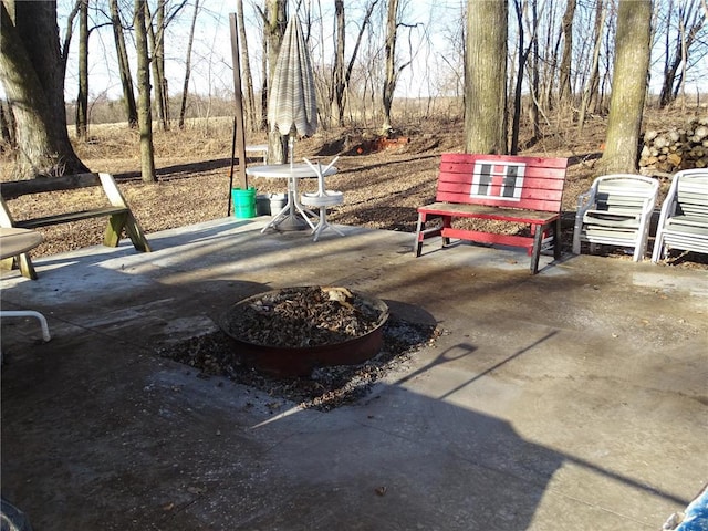 view of patio / terrace with an outdoor fire pit