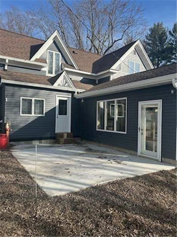 rear view of property featuring a patio area