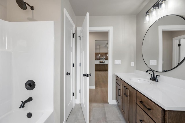 2570 Meyer Way, De Pere, WI 54115 - full bathroom with shower / bathtub combination, vanity, tile patterned floors, and baseboards