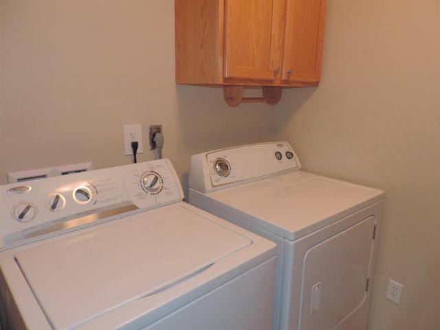 laundry area featuring cabinet space and washer and dryer