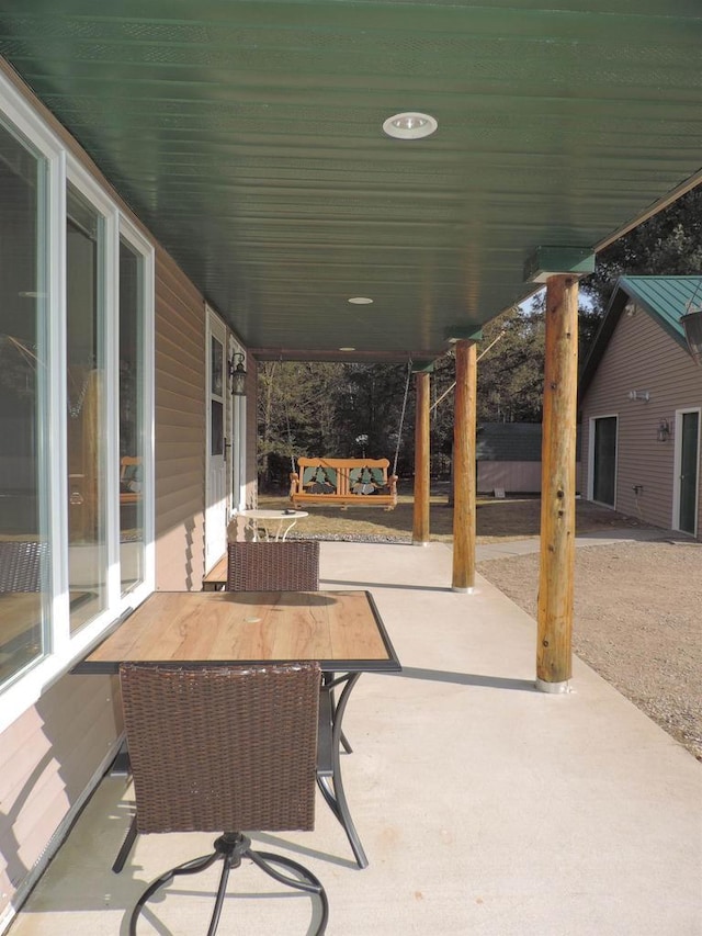 view of patio featuring outdoor dining area