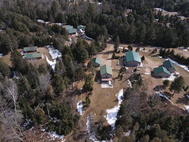 aerial view featuring a wooded view