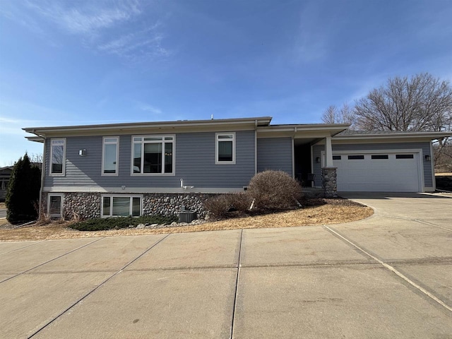 view of front of property featuring a garage and driveway