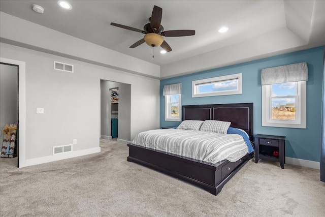 bedroom with visible vents, carpet, and baseboards