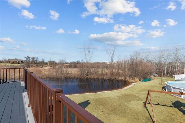 exterior space featuring a water view and a lawn