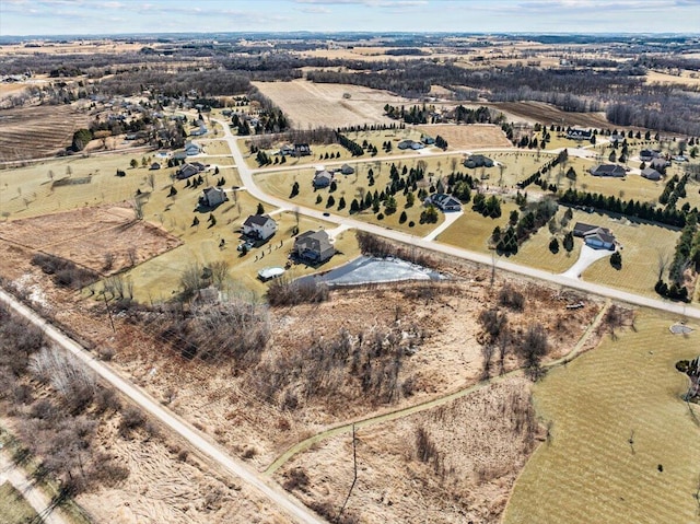 birds eye view of property featuring a rural view