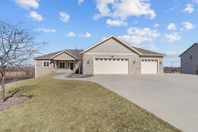 view of front of home featuring stone siding, an attached garage, concrete driveway, and a front yard