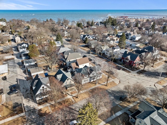 birds eye view of property with a residential view and a water view