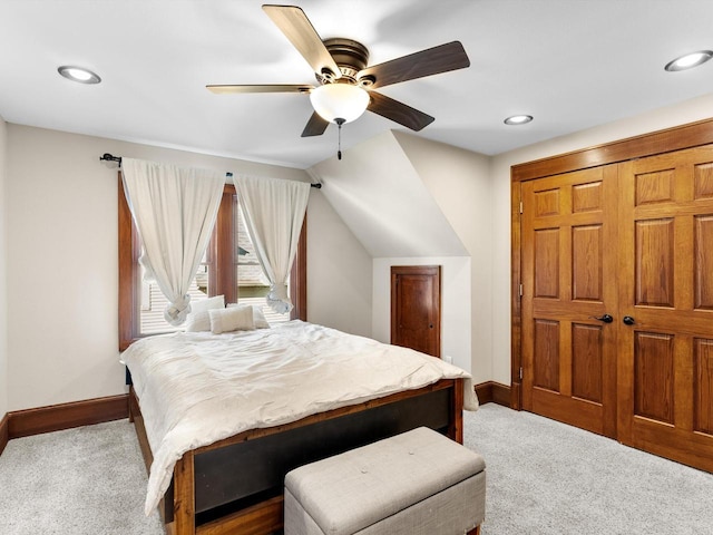 bedroom with lofted ceiling, carpet flooring, a ceiling fan, and baseboards