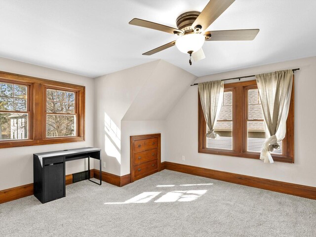 bonus room with vaulted ceiling, a ceiling fan, baseboards, and carpet floors