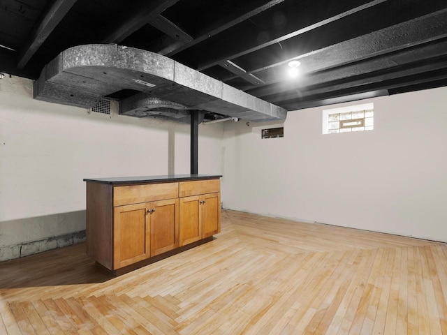 basement featuring light wood finished floors