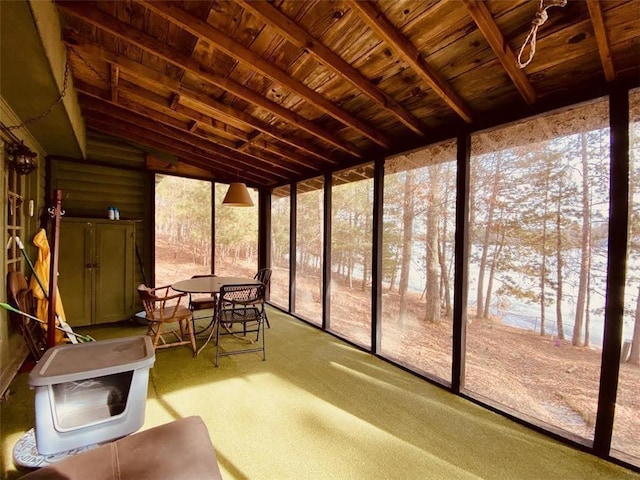 unfurnished sunroom with vaulted ceiling and wood ceiling