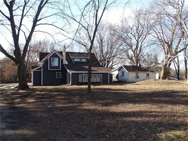 exterior space featuring a chimney