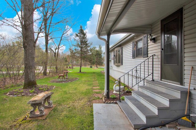 view of yard with entry steps