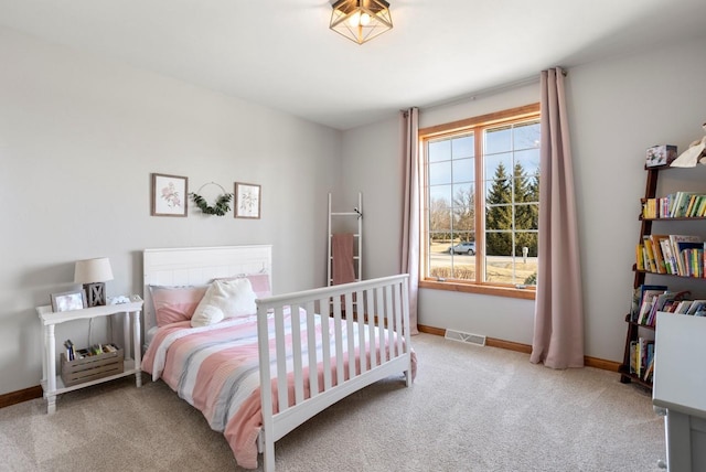 bedroom with visible vents, baseboards, and carpet floors