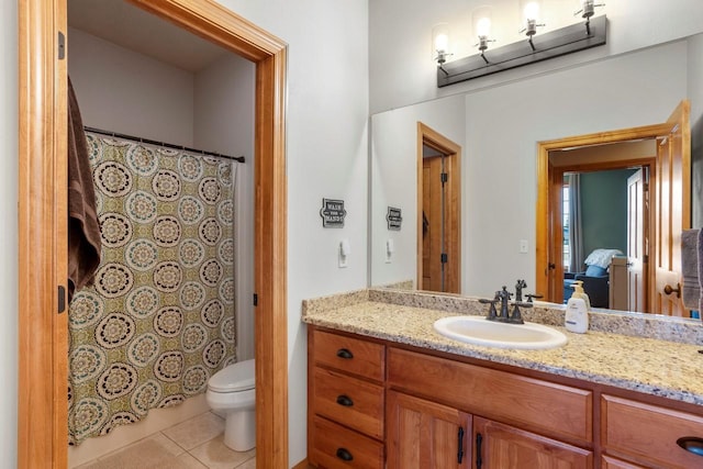 bathroom with tile patterned flooring, a shower with shower curtain, toilet, and vanity