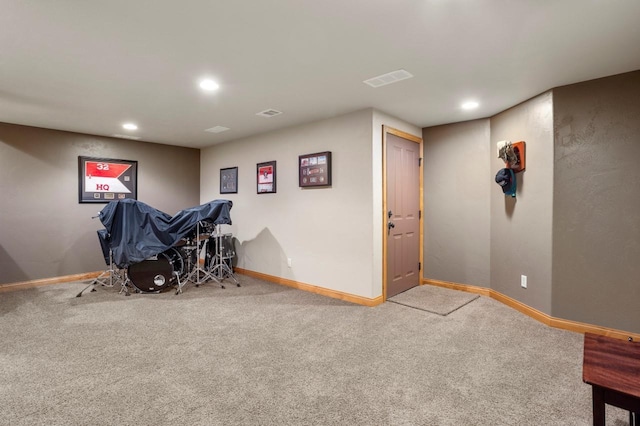 exercise room featuring recessed lighting, baseboards, and carpet floors