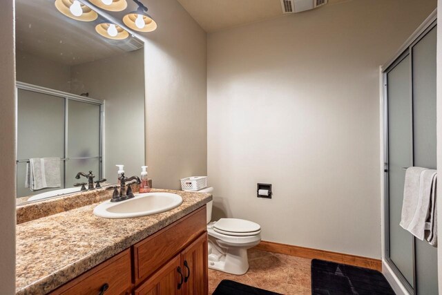 full bathroom with visible vents, toilet, a stall shower, and vanity