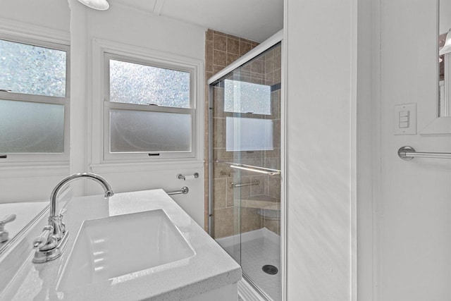 full bathroom featuring a sink and a stall shower