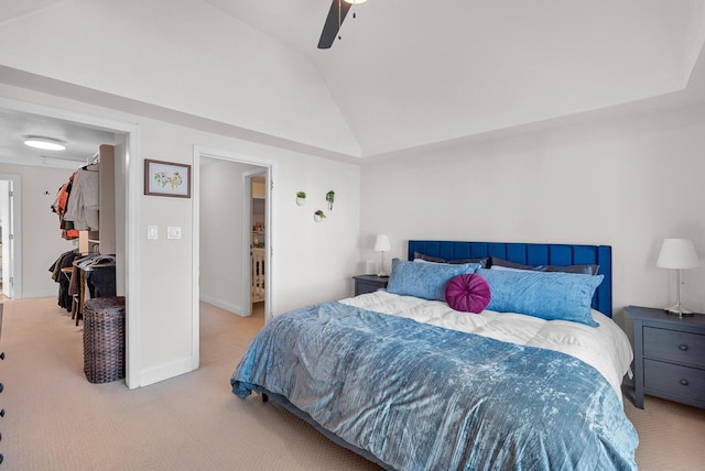 carpeted bedroom featuring vaulted ceiling, a ceiling fan, and baseboards