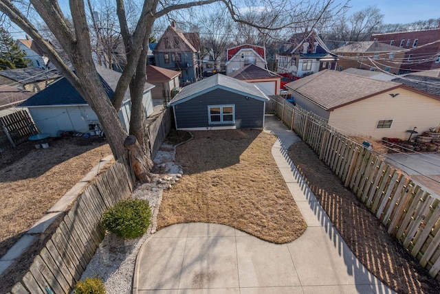 exterior space featuring a residential view and a fenced backyard