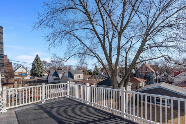 wooden deck featuring a residential view