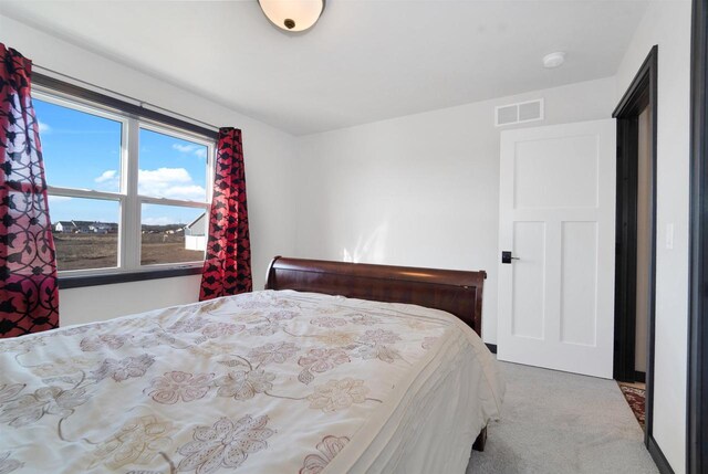 bedroom featuring visible vents and carpet floors