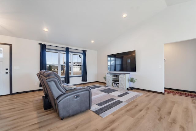 living room with recessed lighting, high vaulted ceiling, light wood-type flooring, and baseboards