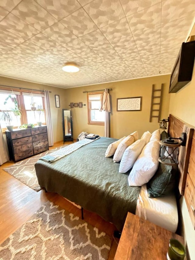 bedroom featuring wood finished floors