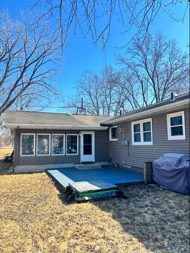 rear view of house with a lawn