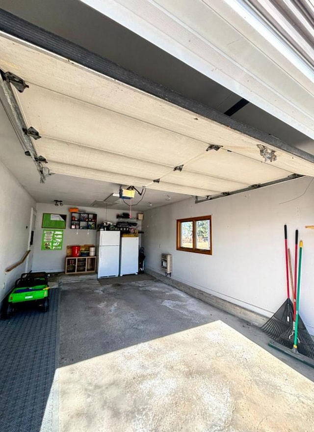 garage with freestanding refrigerator