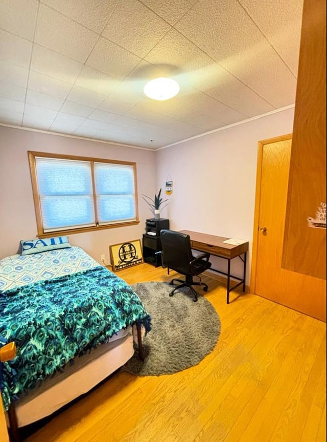 bedroom featuring wood finished floors