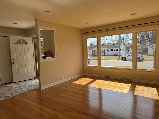 interior space with visible vents, recessed lighting, baseboards, and wood finished floors