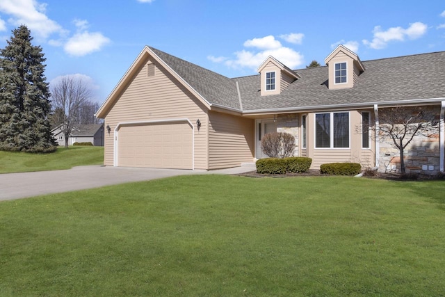 new england style home with a garage, driveway, a front lawn, and a shingled roof