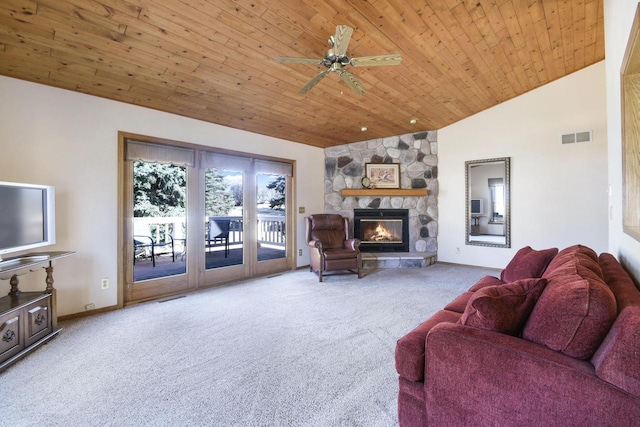 living room with visible vents, carpet floors, wood ceiling, and a fireplace