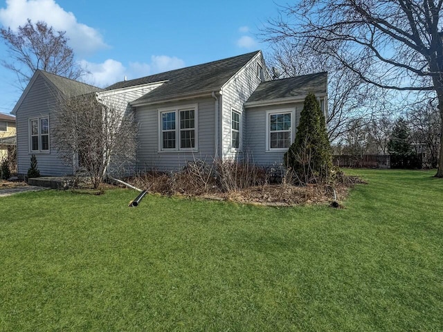 view of home's exterior with a yard