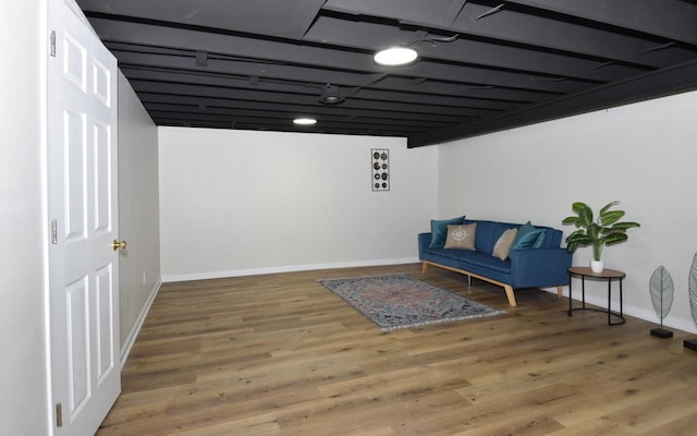 sitting room featuring wood finished floors and baseboards