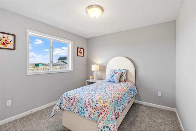 carpeted bedroom with baseboards