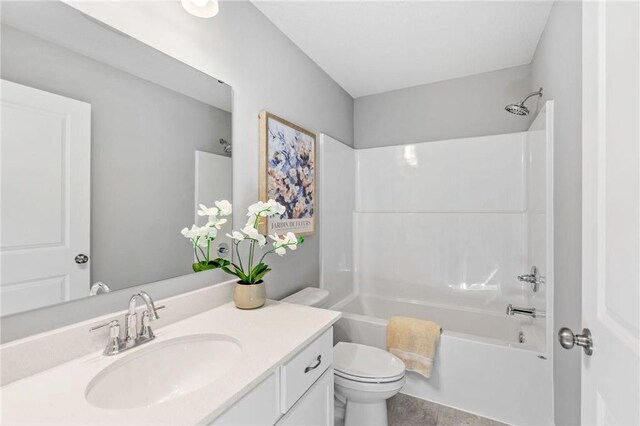 bathroom with vanity, toilet, and bathing tub / shower combination