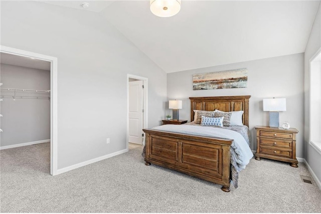 carpeted bedroom featuring visible vents, high vaulted ceiling, a closet, baseboards, and a spacious closet