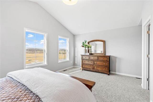 bedroom featuring carpet flooring, visible vents, baseboards, and lofted ceiling