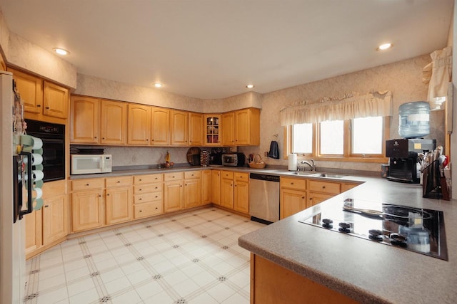 kitchen with glass insert cabinets, light floors, recessed lighting, black appliances, and a sink