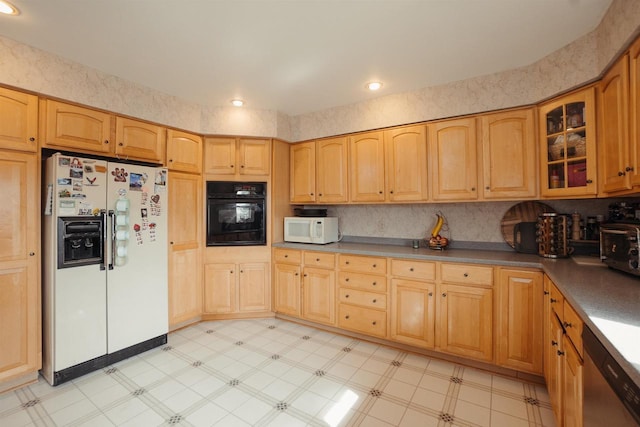 kitchen featuring white appliances, light floors, light brown cabinets, a toaster, and glass insert cabinets